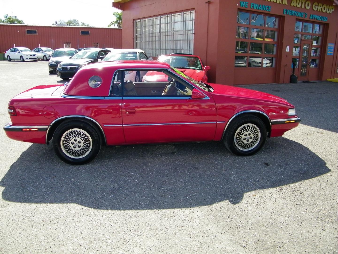 1991 Red /Beige Chrysler TC By Maserati Convertible (ZC2FS1207MB) with an 3.0L V6 SOHC 12V engine, 4-Speed Automatic Overdrive transmission, located at 4000 Bee Ridge Road, Sarasota, FL, 34233, (941) 926-0300, 27.298664, -82.489151 - Photo#5